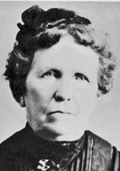 A black and white photo of an older woman.